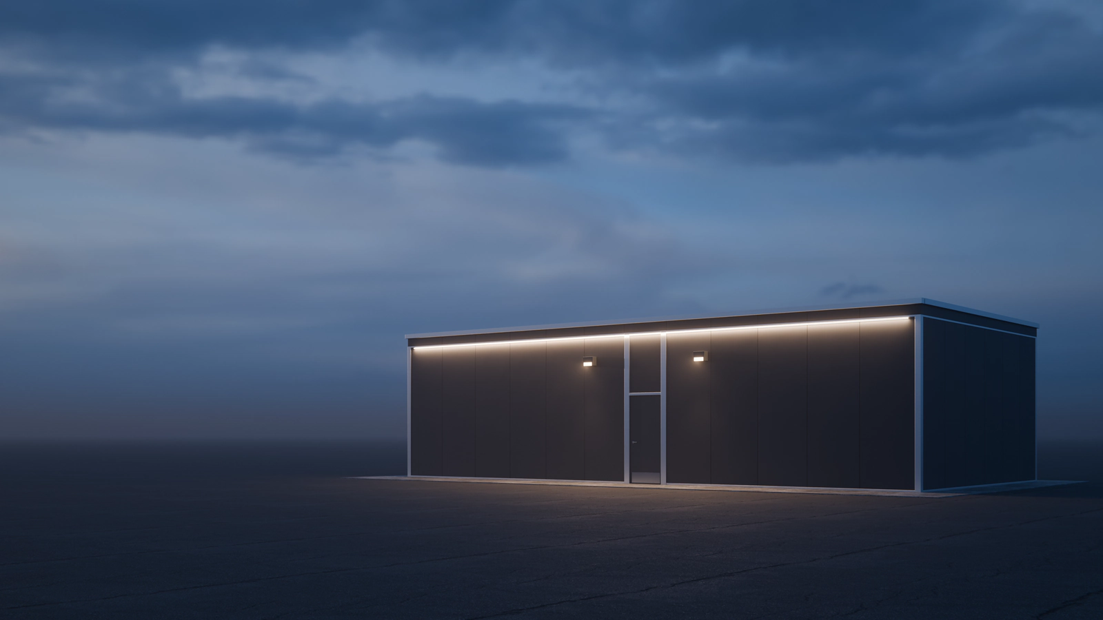 A generic Centurion Vault Series modular facility at dusk on an open paved lot, a line of warm light along its roof washing down the 4 ft rhythm of its wall panels.